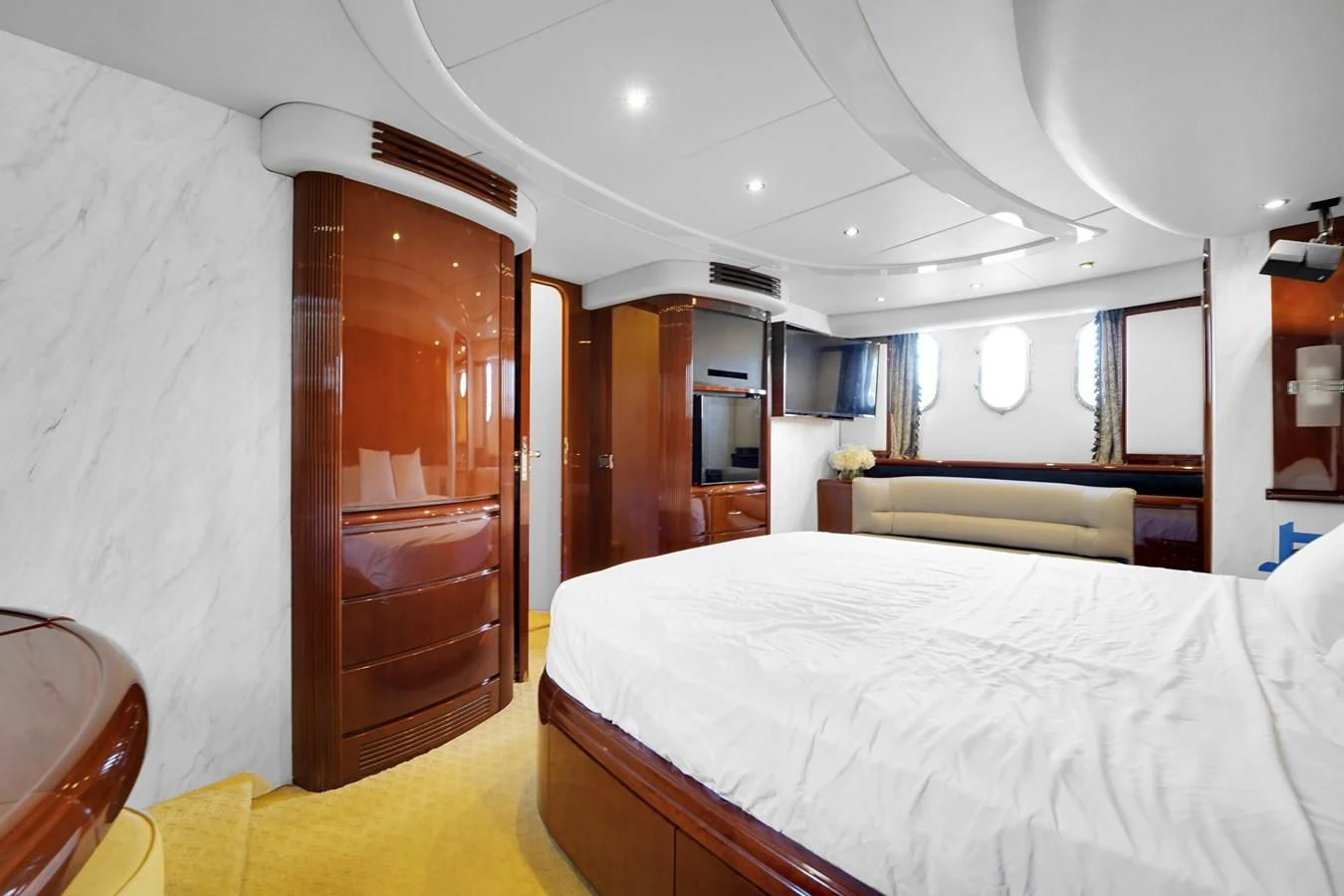 a bedroom with a bed and a closet aboard AZIMUT 80 2003 Yacht for Sale