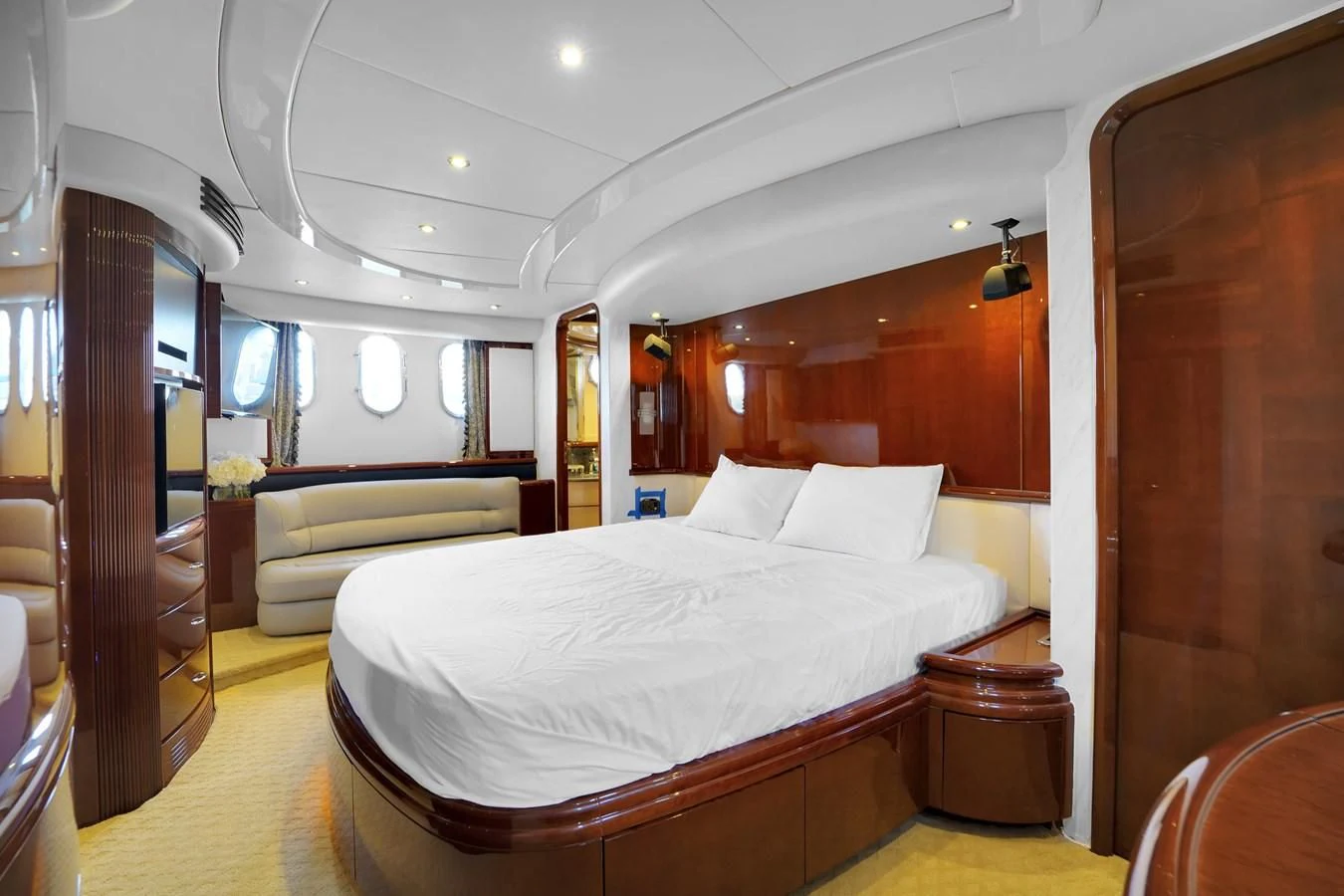 a room with a bed and a chair aboard AZIMUT 80 2003 Yacht for Sale