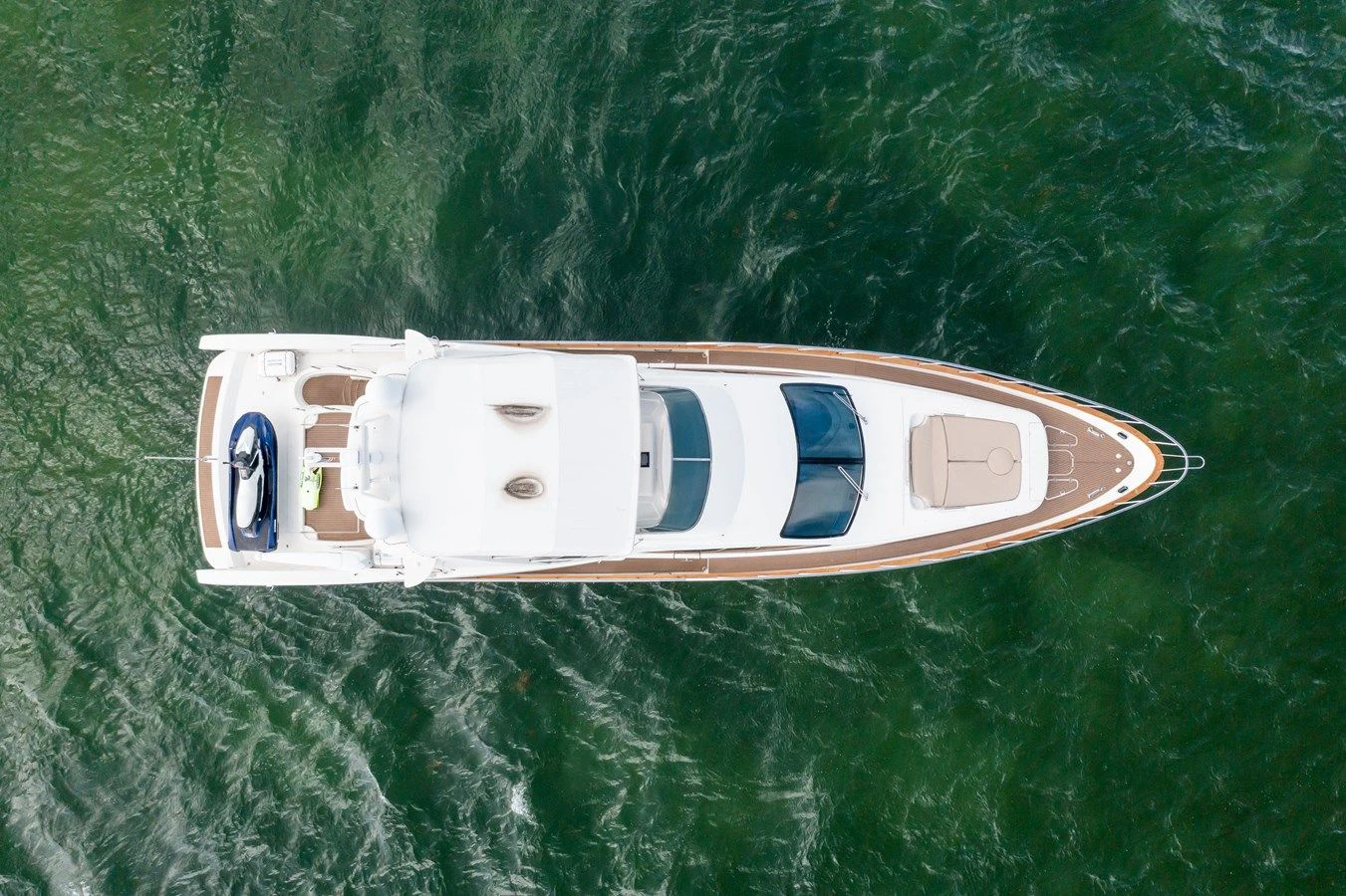 a white rectangular object with a blue stripe on a green surface aboard AZIMUT 80 2003 Yacht for Sale
