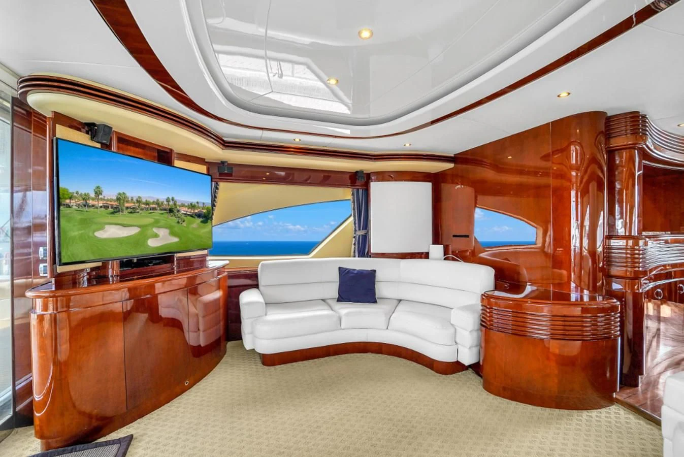 a room with a couch and a television aboard AZIMUT 80 2003 Yacht for Sale