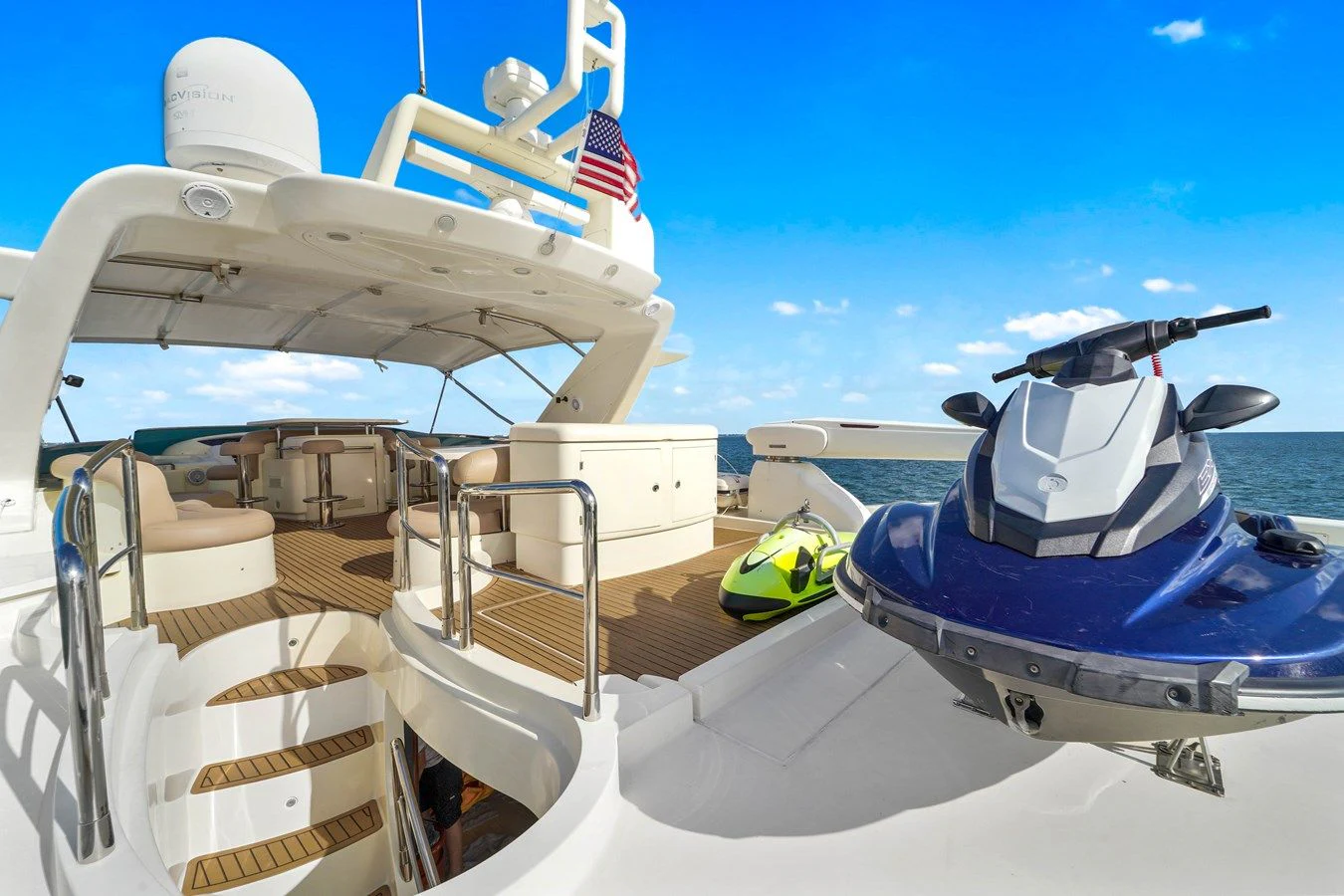 a boat with a flag on the deck aboard AZIMUT 80 2003 Yacht for Sale