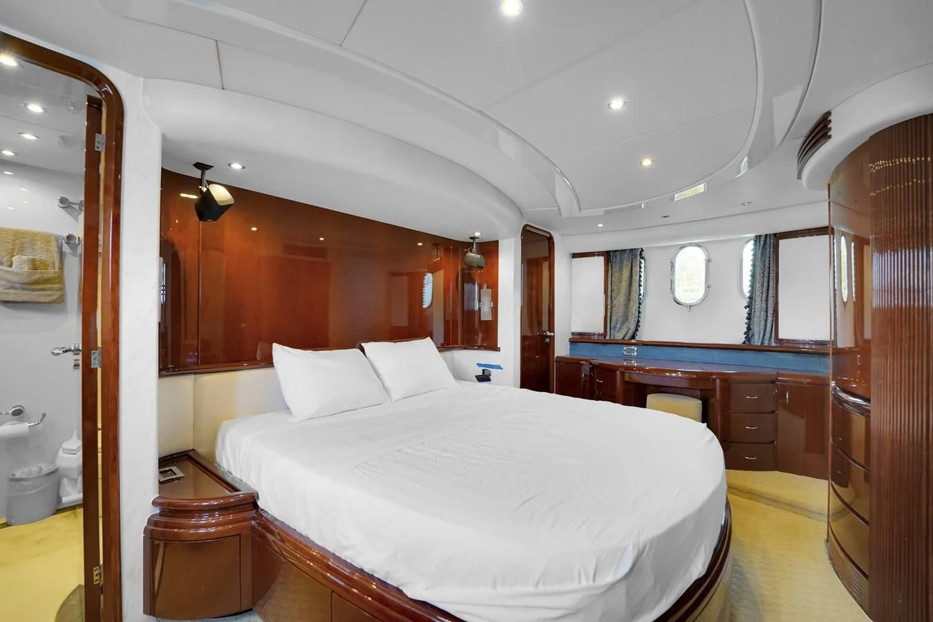 a large bedroom with a large bed aboard AZIMUT 80 2003 Yacht for Sale