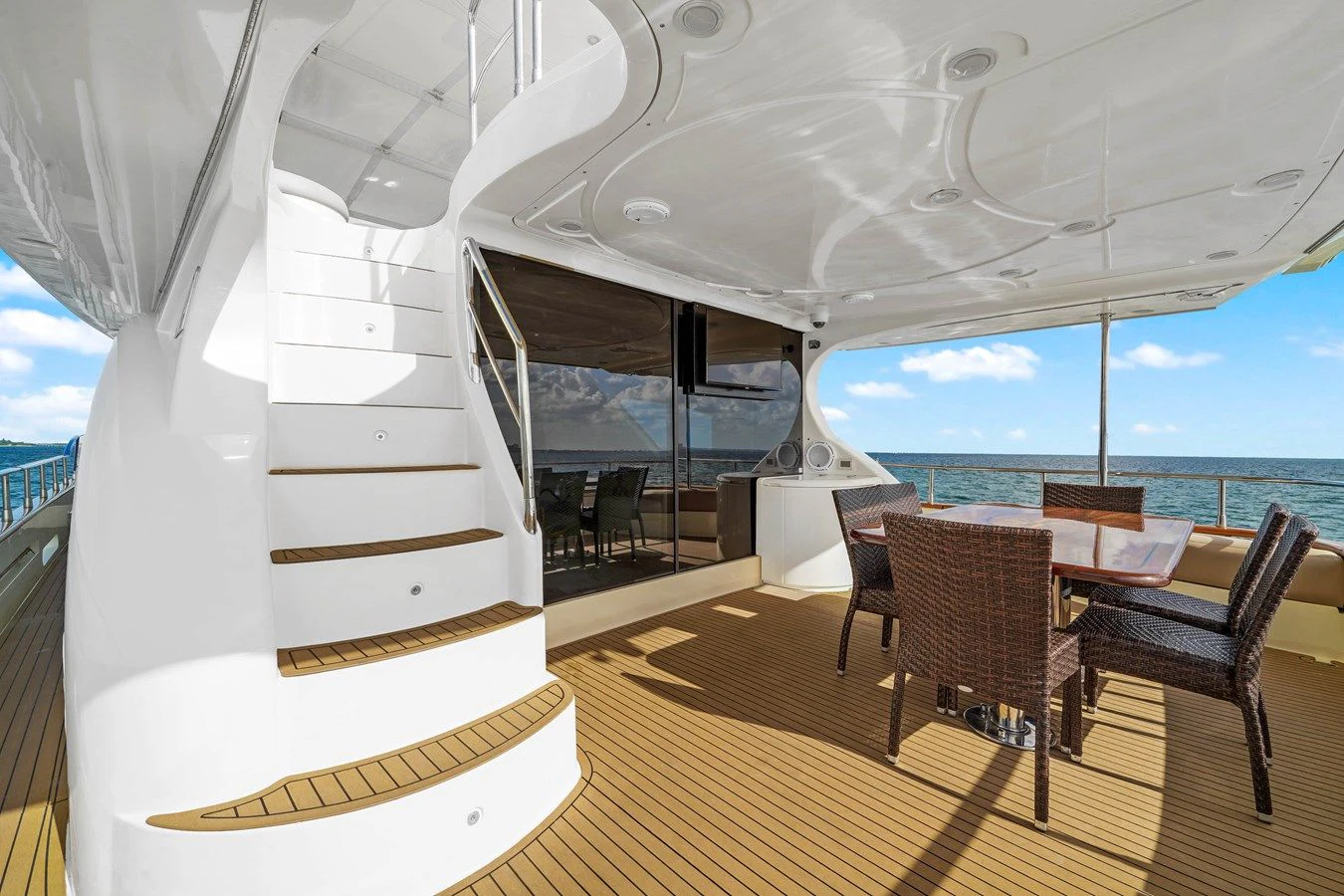 a room with a table and chairs aboard AZIMUT 80 2003 Yacht for Sale