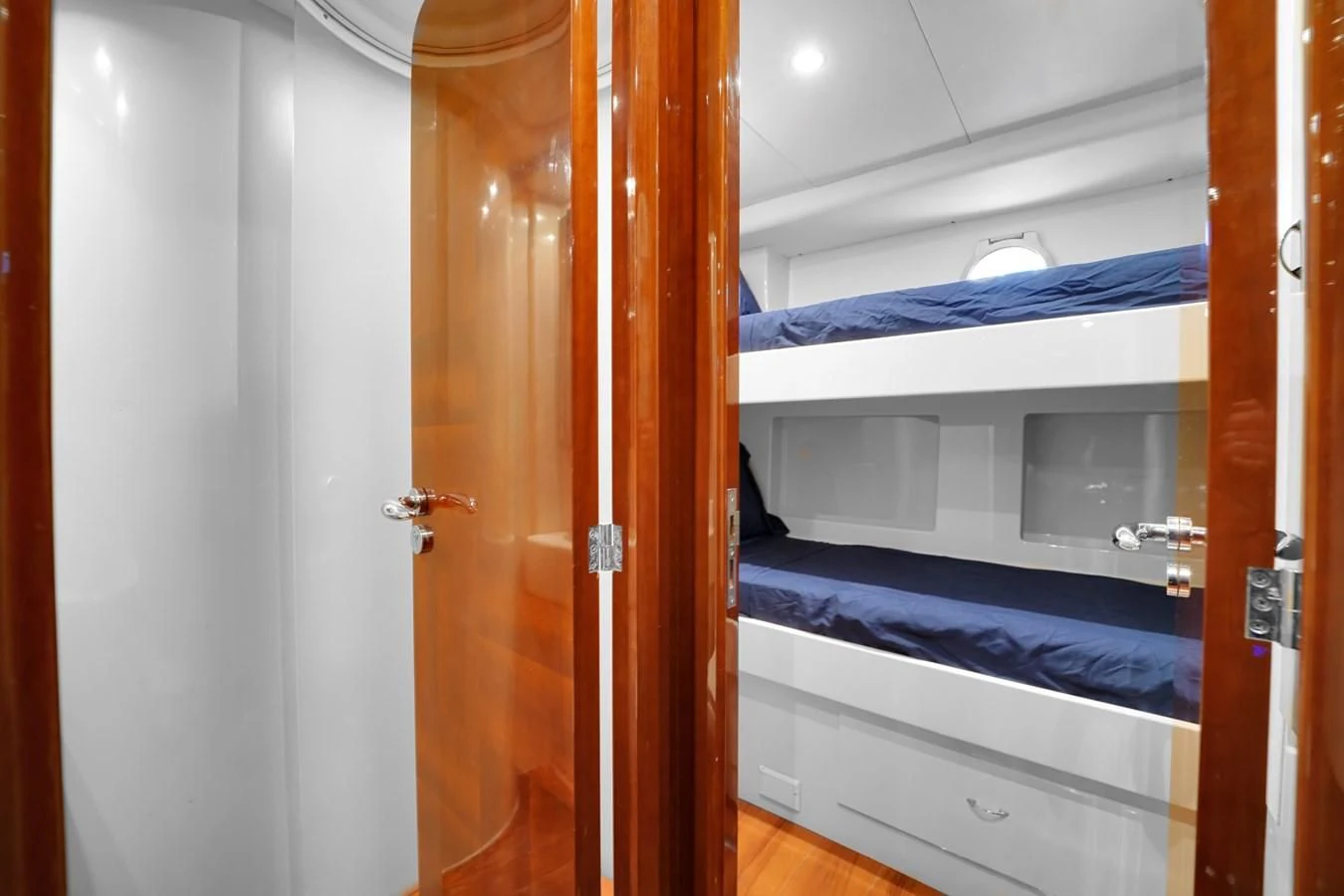 a room with a closet and a bed aboard AZIMUT 80 2003 Yacht for Sale