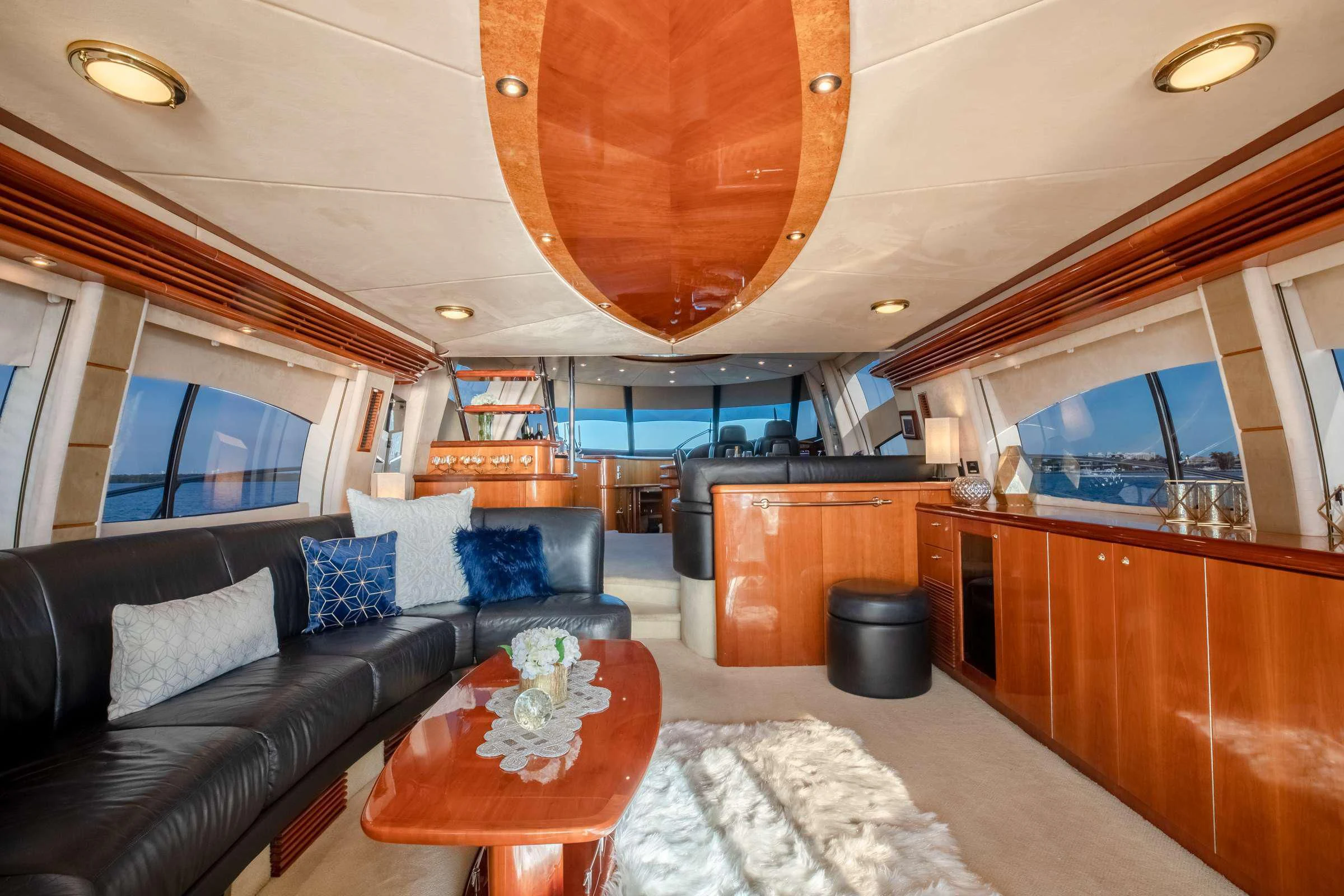 a living room with a large sofa aboard LEOLENA Yacht for Sale