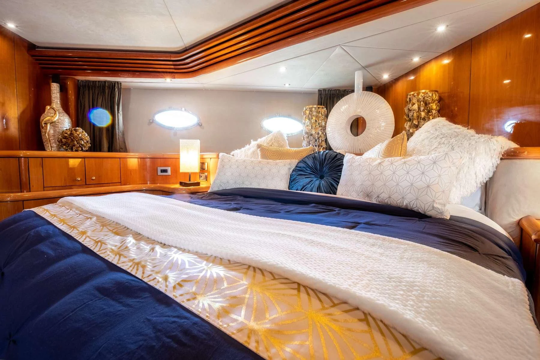 a bed with white sheets aboard LEOLENA Yacht for Sale
