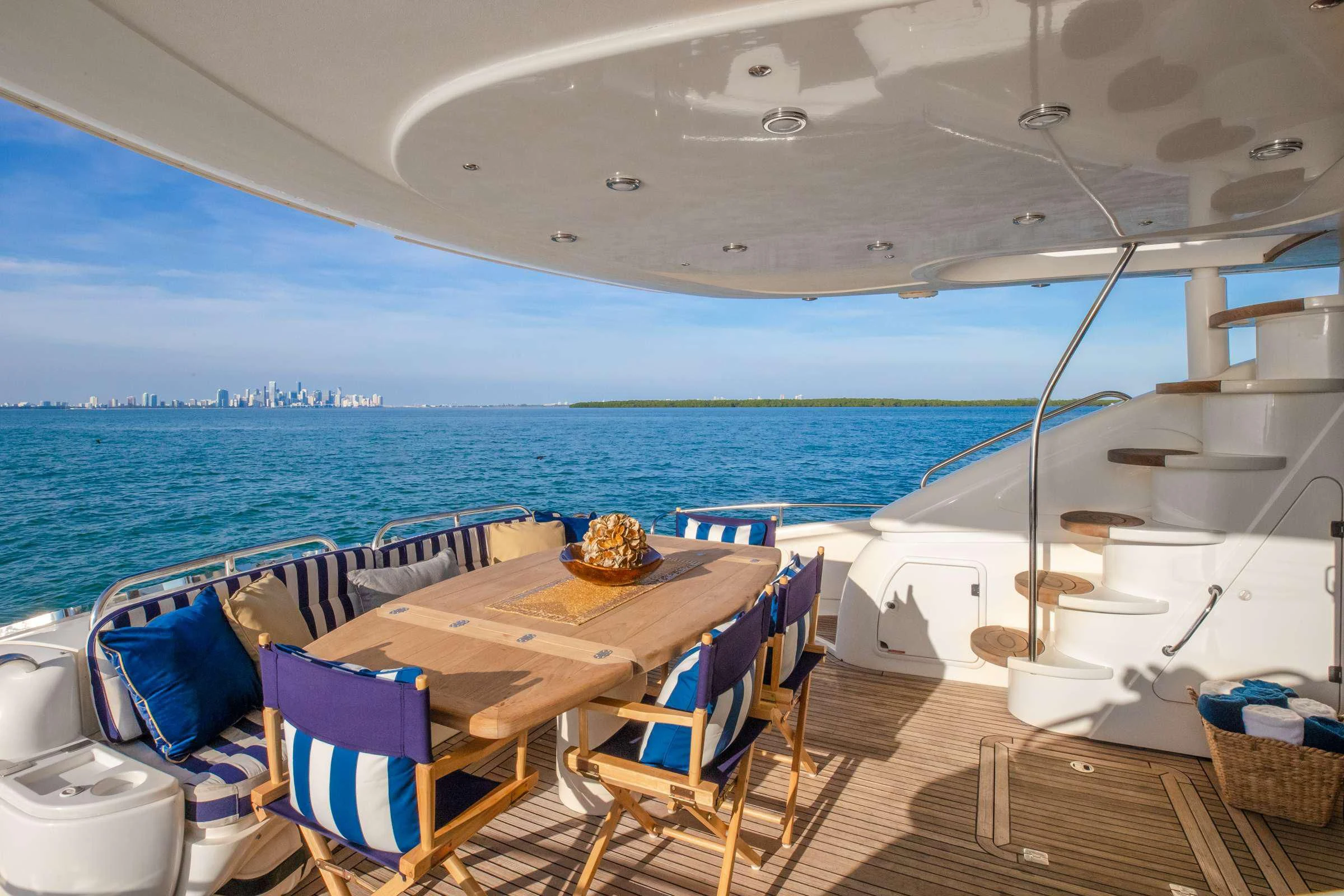 a table and chairs on a boat aboard LEOLENA Yacht for Sale