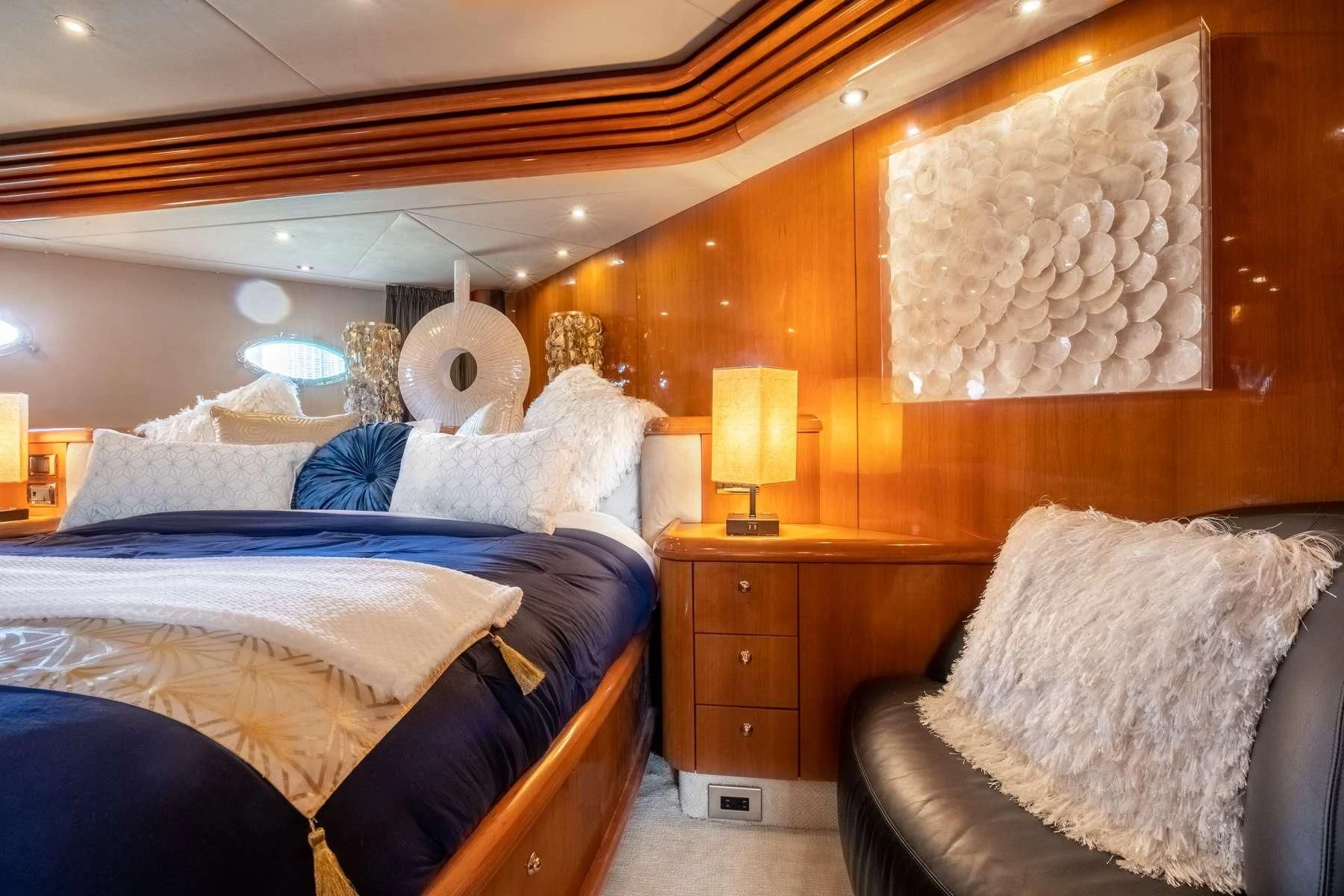 a room with a bed and a fan aboard LEOLENA Yacht for Sale