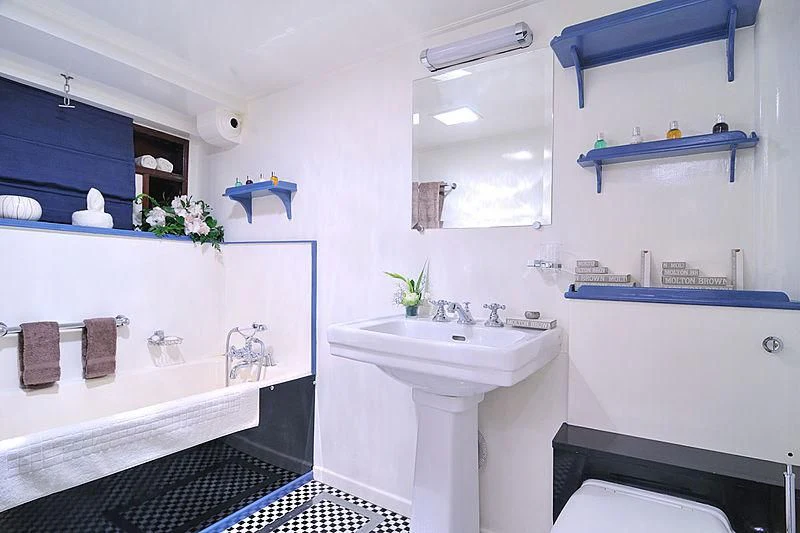 a bathroom with a sink and a mirror aboard CALISTO Yacht for Sale