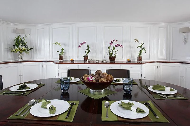 a table with plates and food on it aboard CALISTO Yacht for Sale