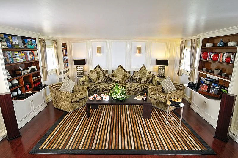 a living room with a large rug aboard CALISTO Yacht for Sale