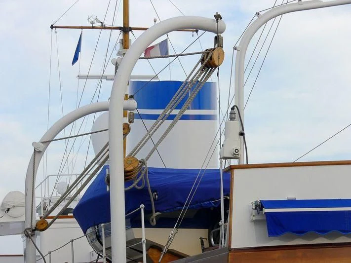 a boat with ropes and a blue sail aboard CALISTO Yacht for Sale