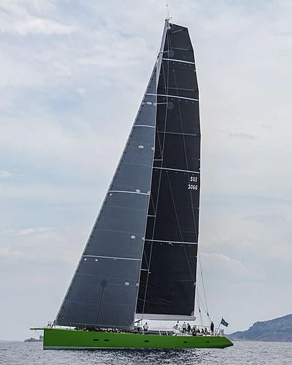 a sailboat on the water with Bennington Battle Monument in the background aboard INOUI Yacht for Sale
