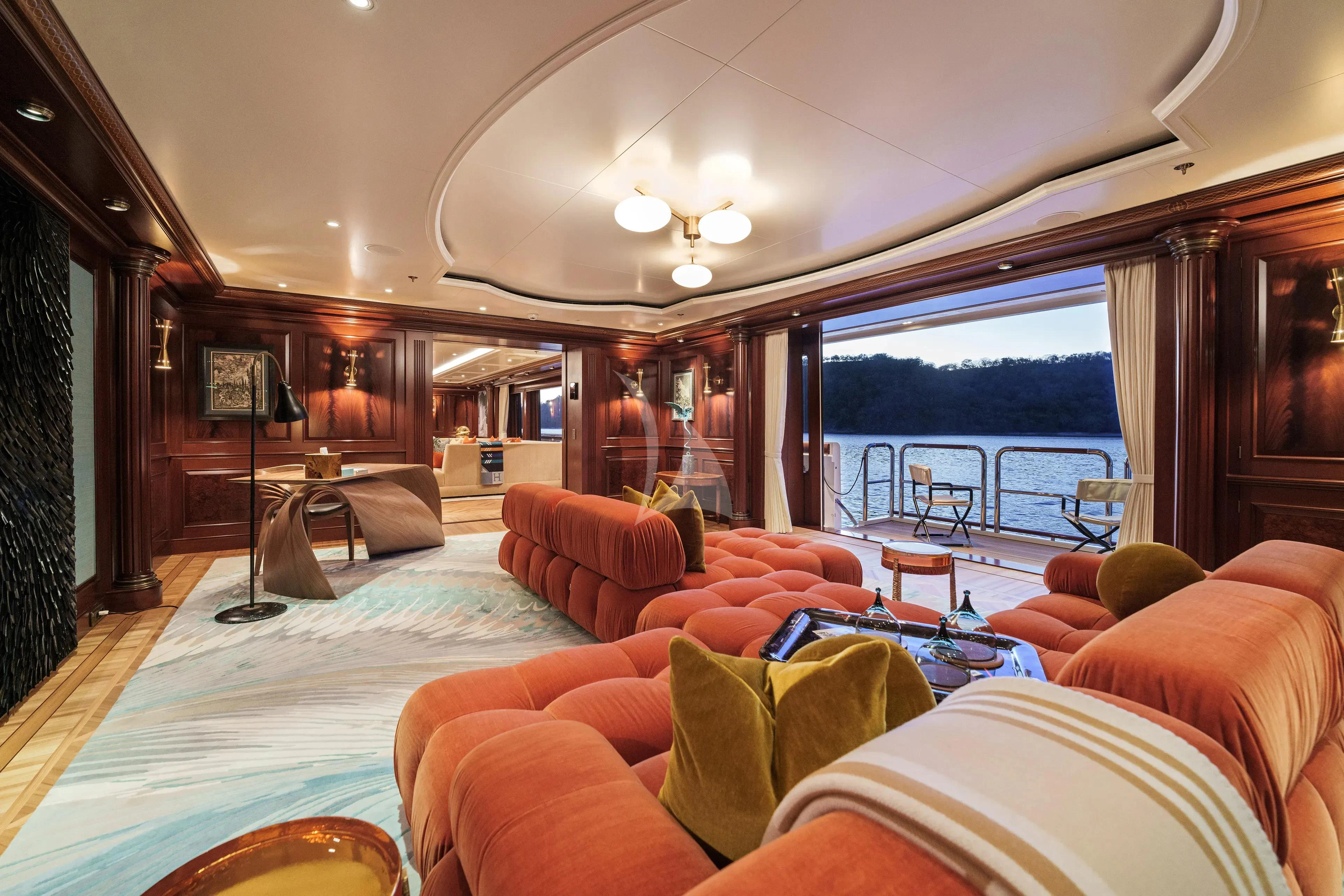 a living room with a large balcony aboard FIREBIRD Yacht for Charter