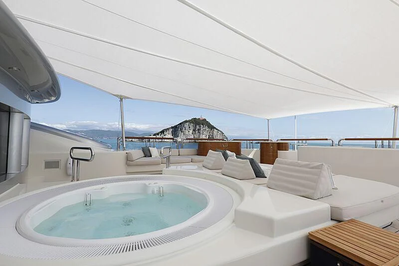 a large white room with a pool aboard FIREBIRD Yacht for Charter