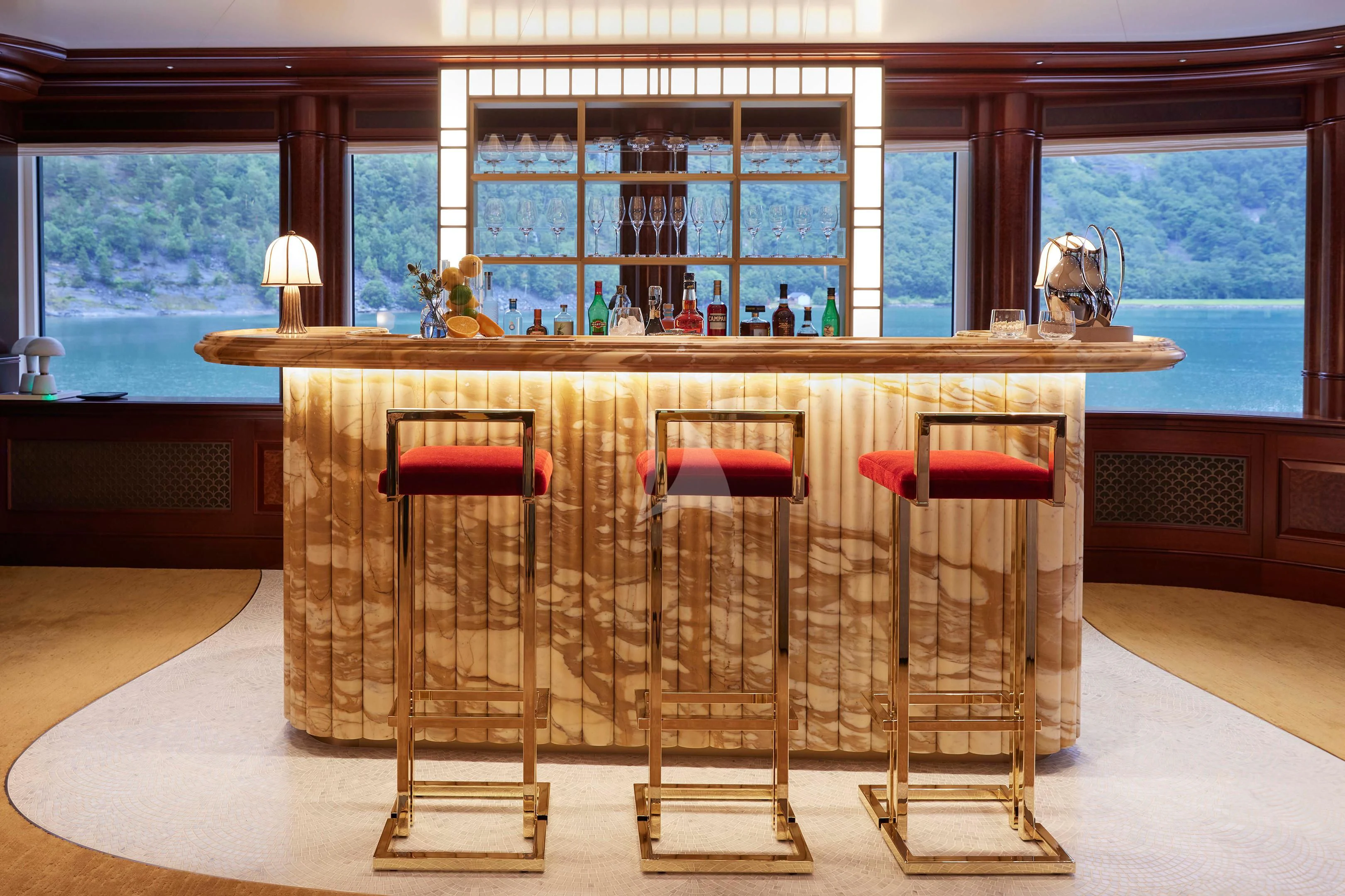 a room with a table chairs and a window aboard FIREBIRD Yacht for Charter