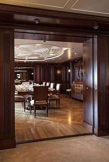 a room with a table and chairs aboard FIREBIRD Yacht for Charter