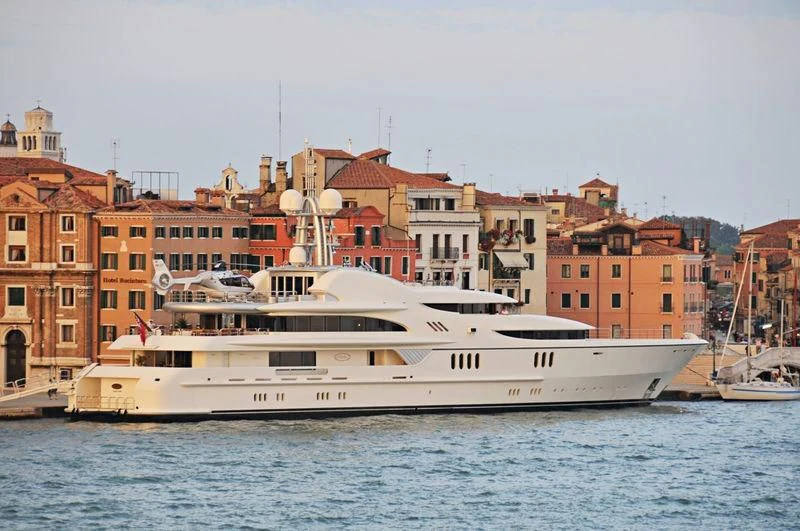 a large white boat in the water aboard FIREBIRD Yacht for Charter