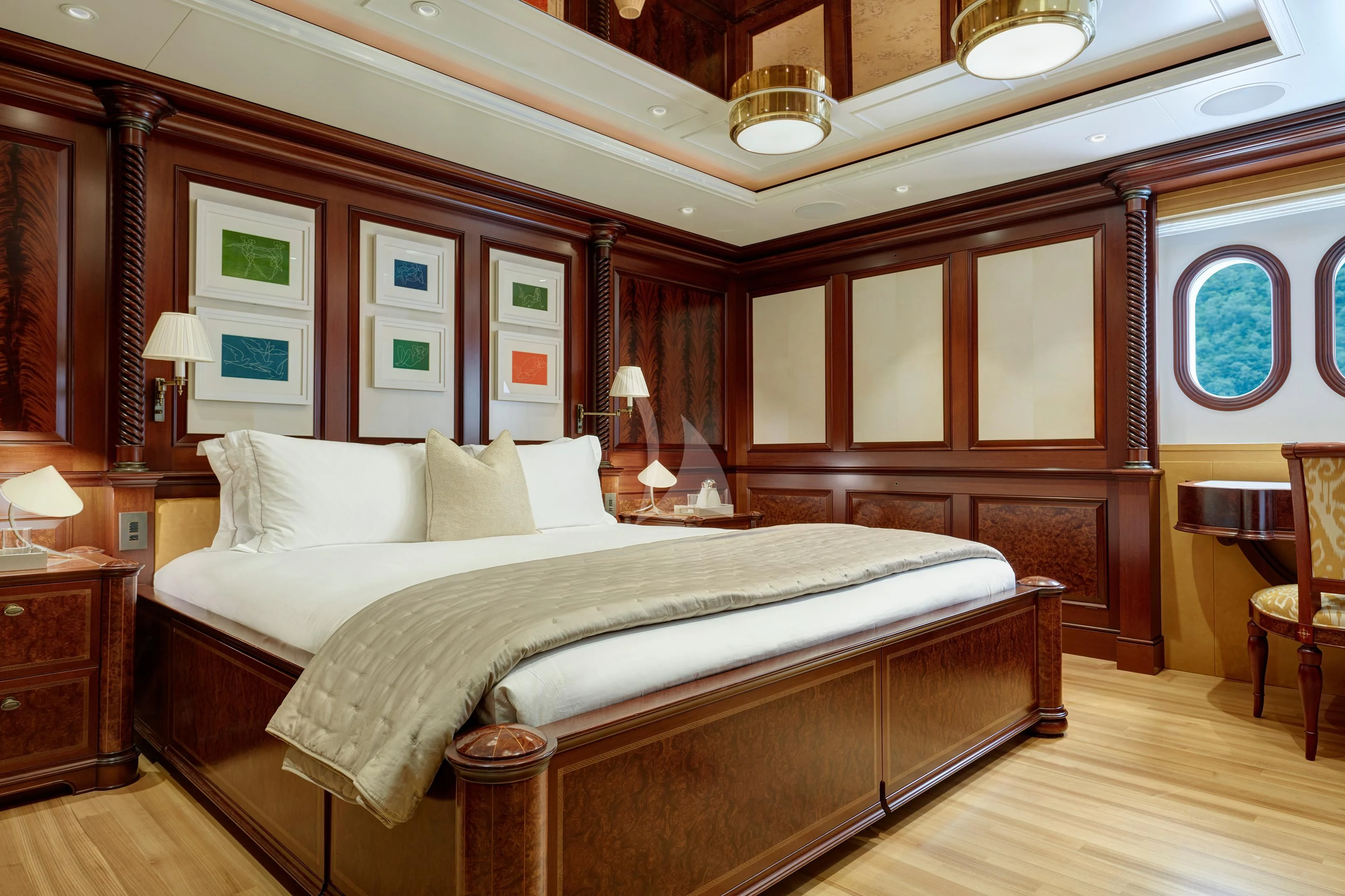 a large bed in a room aboard FIREBIRD Yacht for Charter
