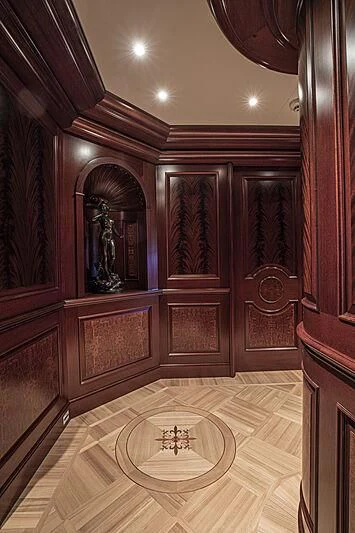 a room with a mirror and a door aboard FIREBIRD Yacht for Charter