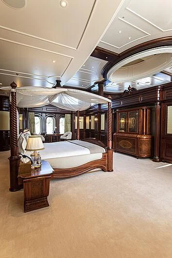 a large bedroom with a canopy bed aboard FIREBIRD Yacht for Charter