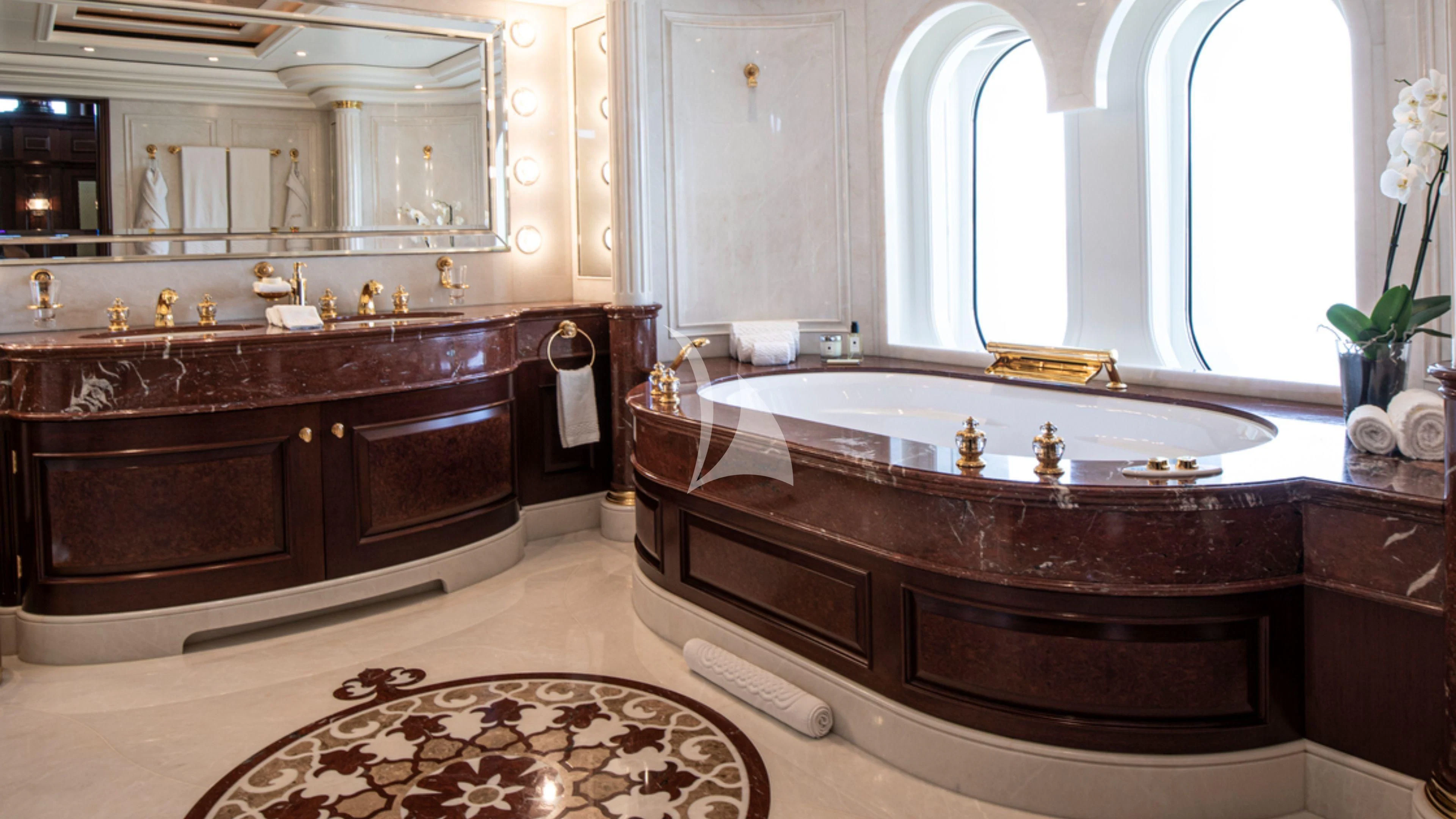 a bathroom with a large bathtub aboard FIREBIRD Yacht for Charter