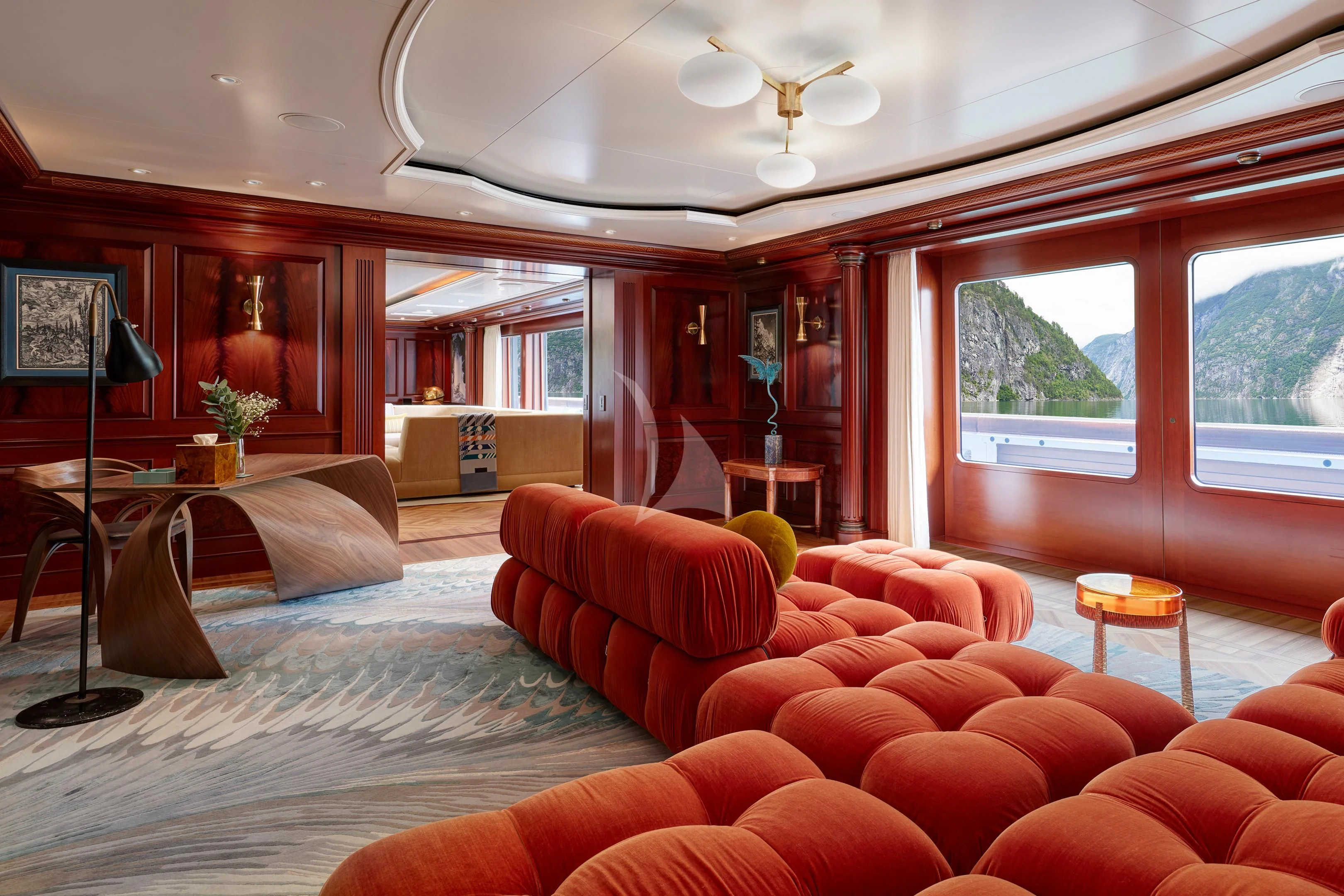 a living room with a large window aboard FIREBIRD Yacht for Charter