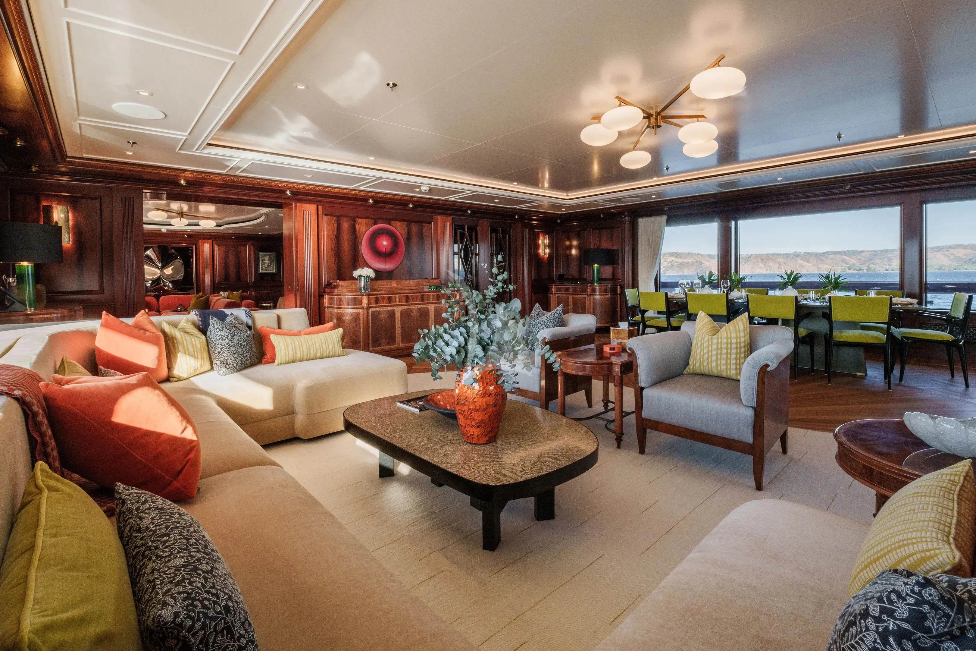 a living room with a large window aboard FIREBIRD Yacht for Charter