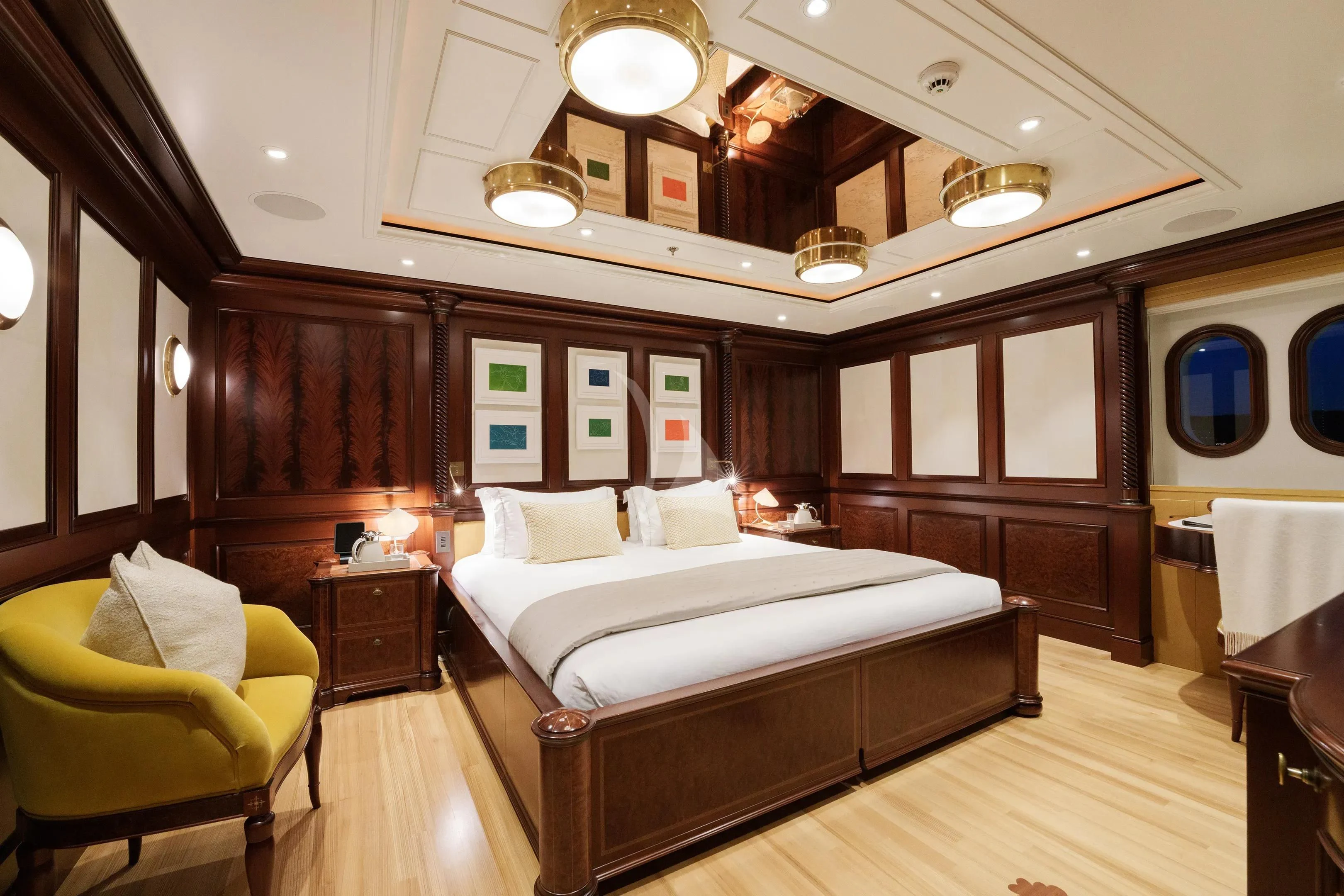 a large bedroom with a bed aboard FIREBIRD Yacht for Charter