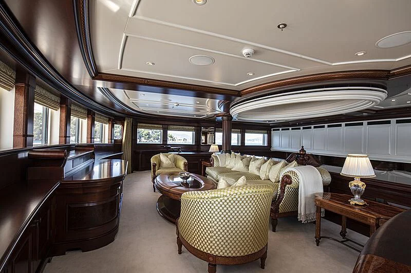 a large room with a piano and a piano aboard FIREBIRD Yacht for Charter