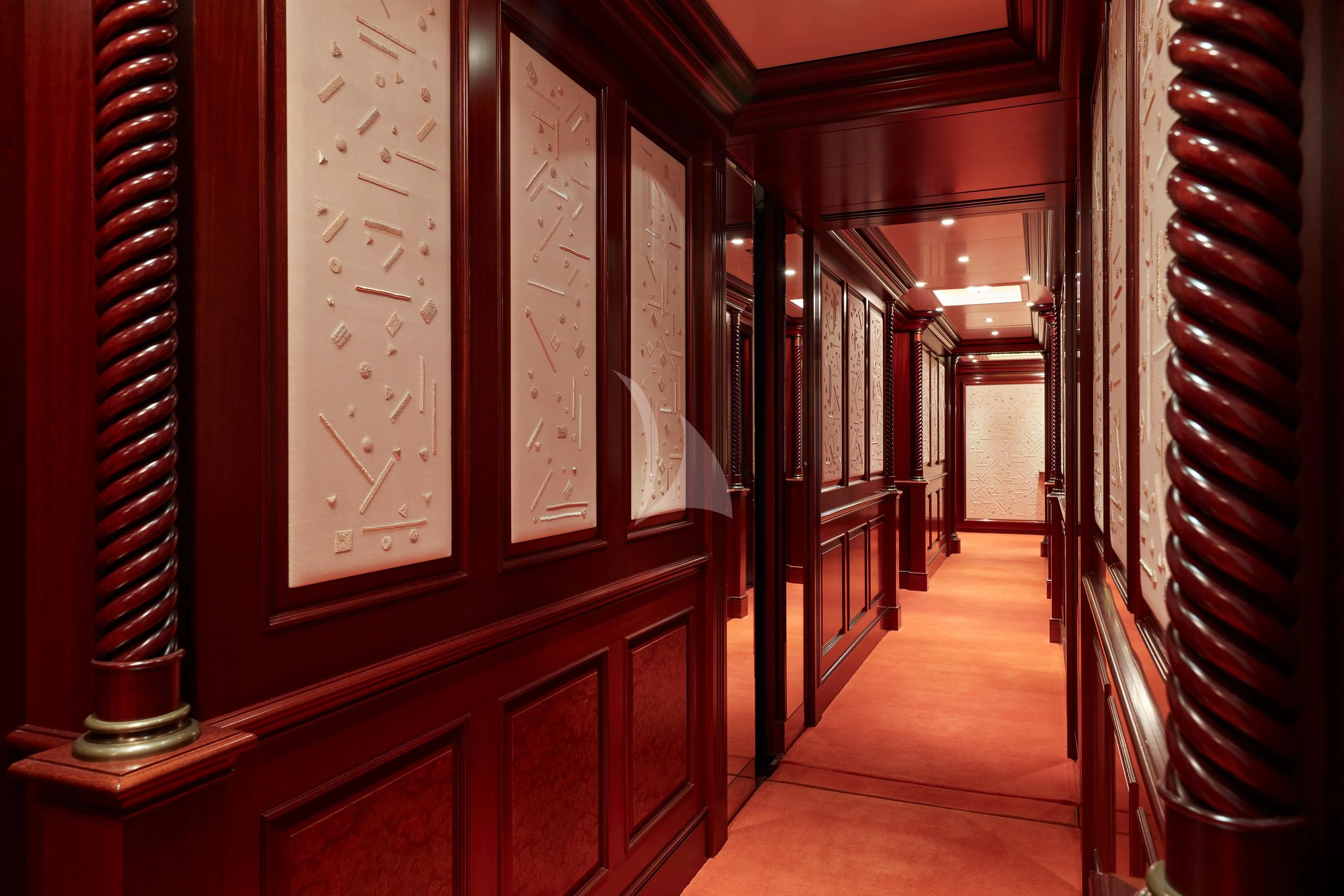 a hallway with books on the wall aboard FIREBIRD Yacht for Charter