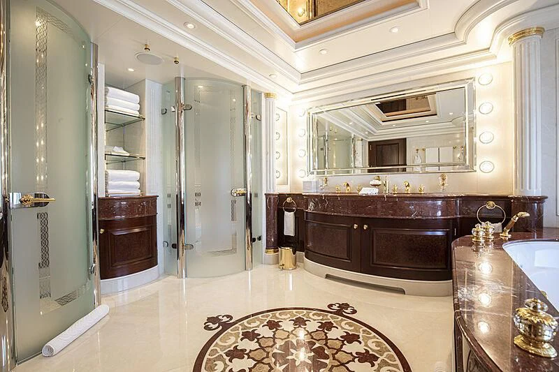 a bathroom with a large mirror aboard FIREBIRD Yacht for Charter