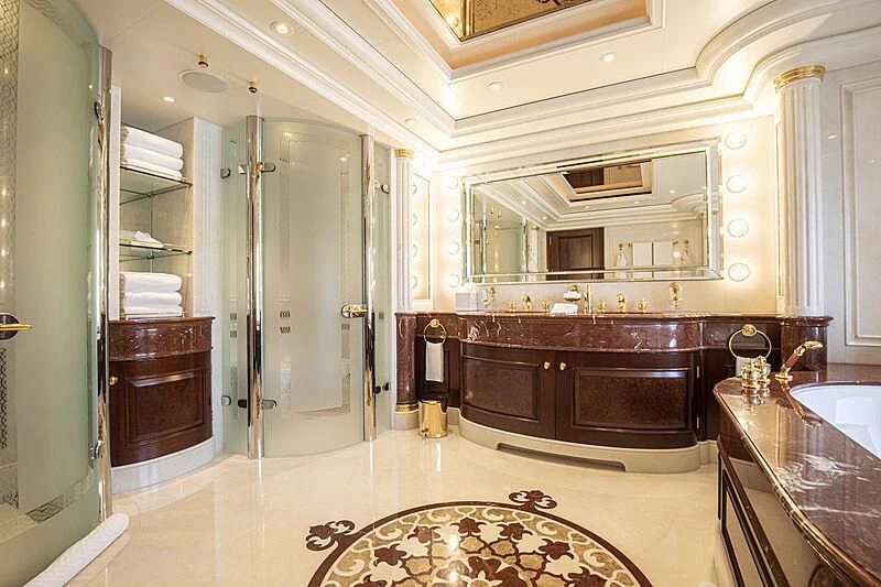 a bathroom with a large mirror aboard FIREBIRD Yacht for Charter
