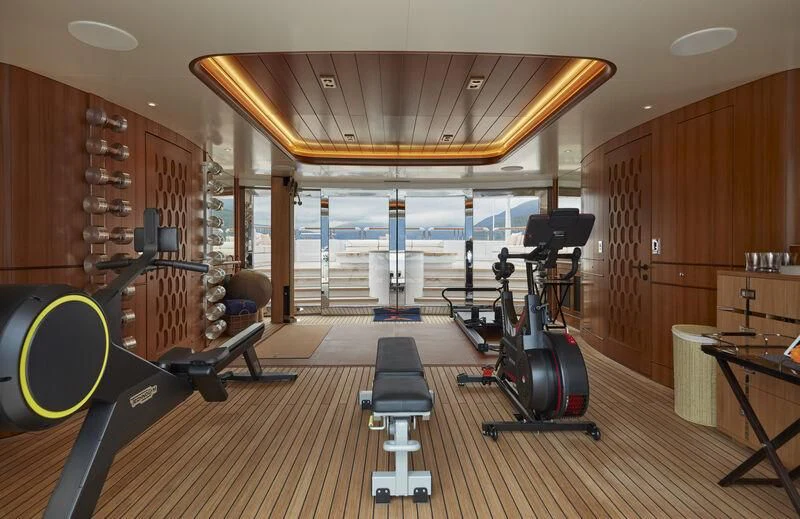 gym with exercise equipment aboard FIREBIRD Yacht for Charter