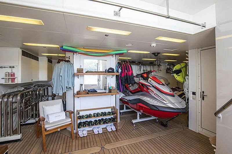 a room with clothes on the swinger aboard FIREBIRD Yacht for Charter