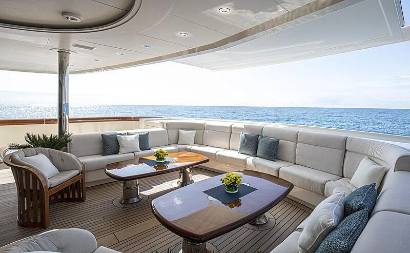 a living room with a large ocean aboard FIREBIRD Yacht for Charter