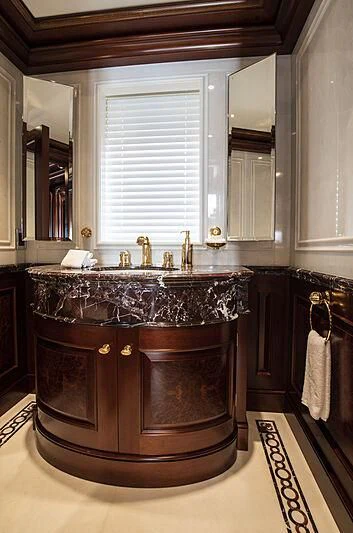 a bathroom with a large marble sink aboard FIREBIRD Yacht for Charter