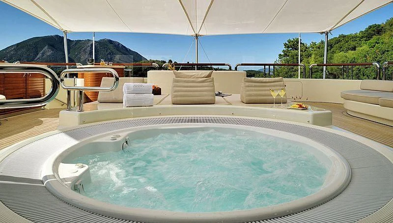 a large swimming pool aboard FIREBIRD Yacht for Charter