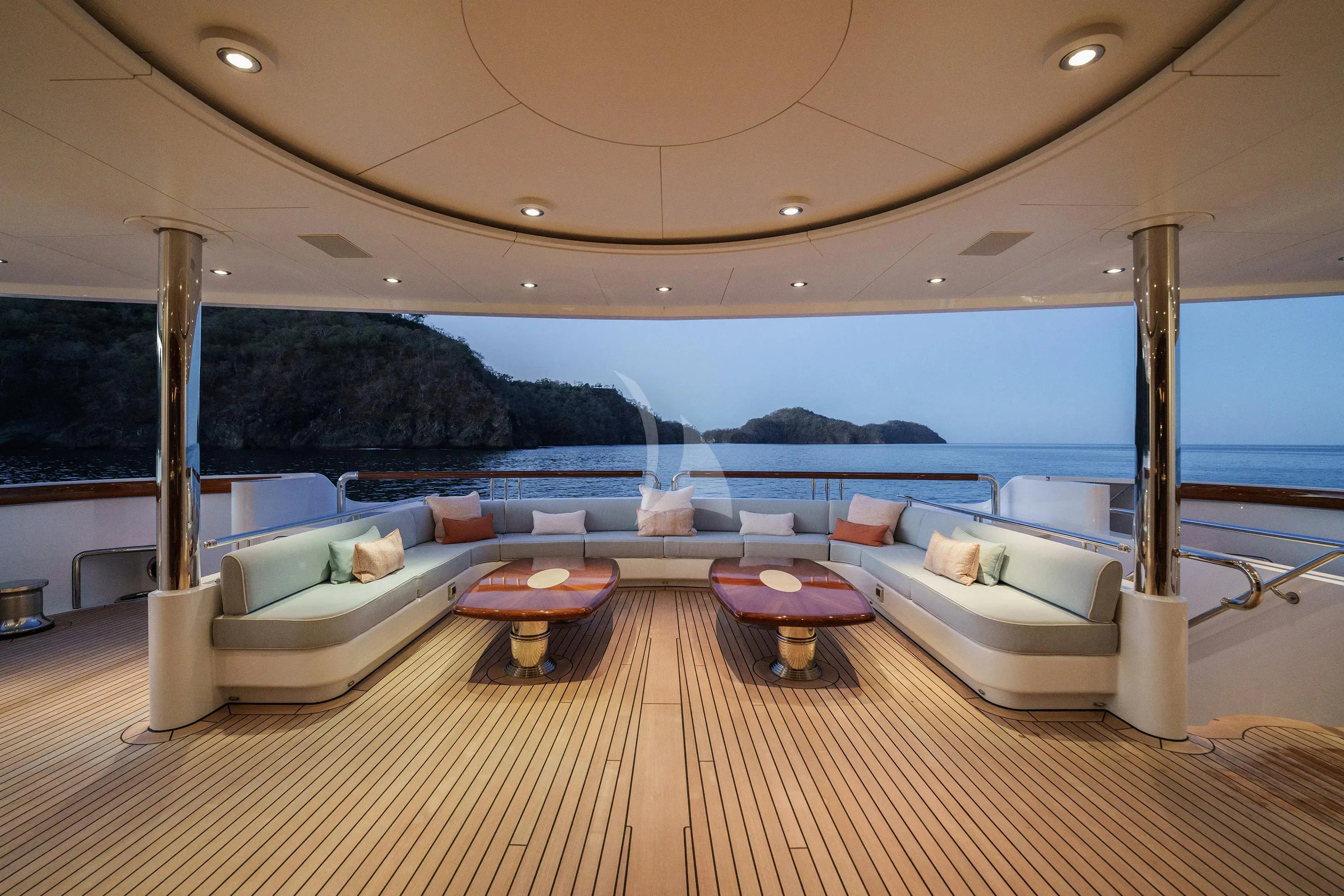 a large living room with a large body of water aboard FIREBIRD Yacht for Charter