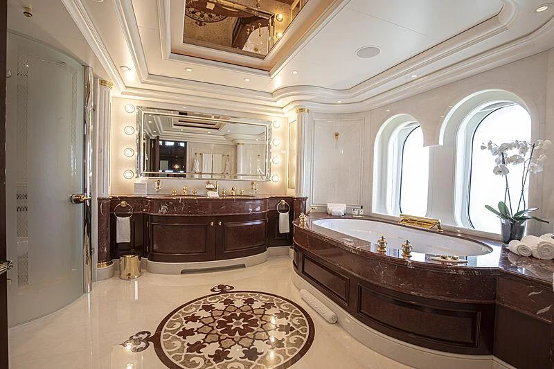 a bathroom with a large marble countertop aboard FIREBIRD Yacht for Charter