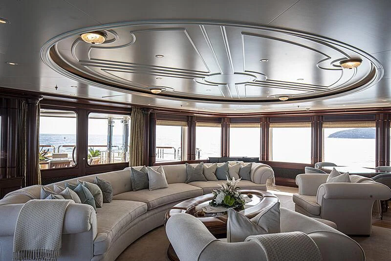a living room with a large window aboard FIREBIRD Yacht for Charter