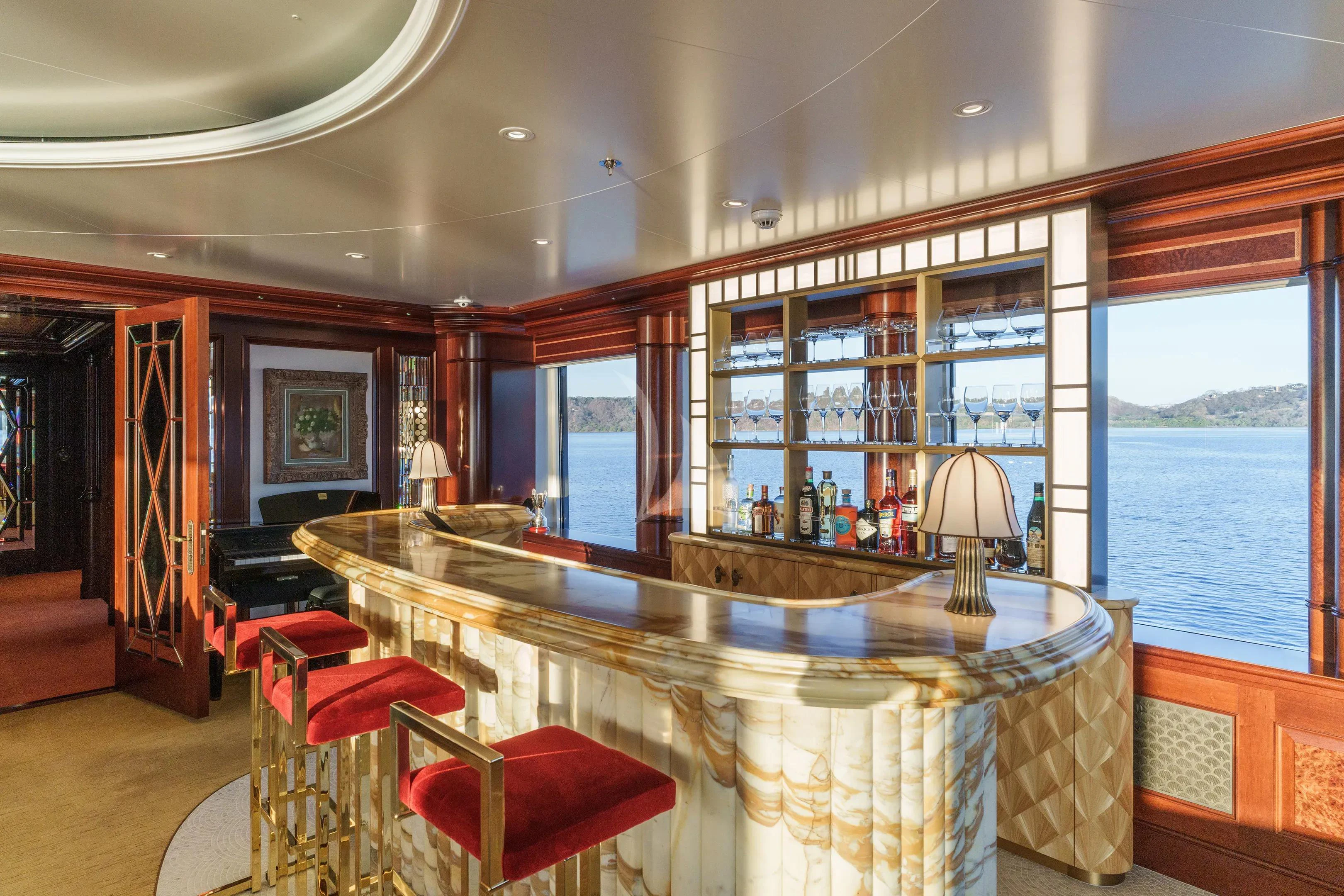 a large dining table in a room aboard FIREBIRD Yacht for Charter