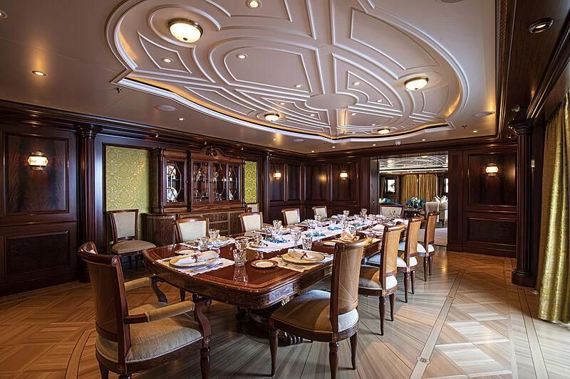 a dining room with a table and chairs aboard FIREBIRD Yacht for Charter