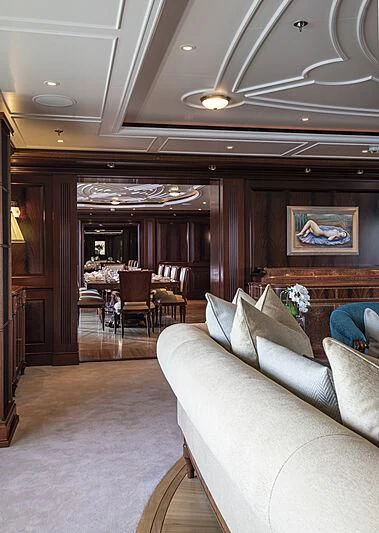 a living room with a couch and a table aboard FIREBIRD Yacht for Charter