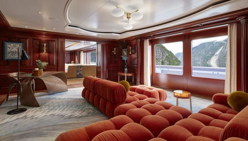 a living room with a large window aboard FIREBIRD Yacht for Charter