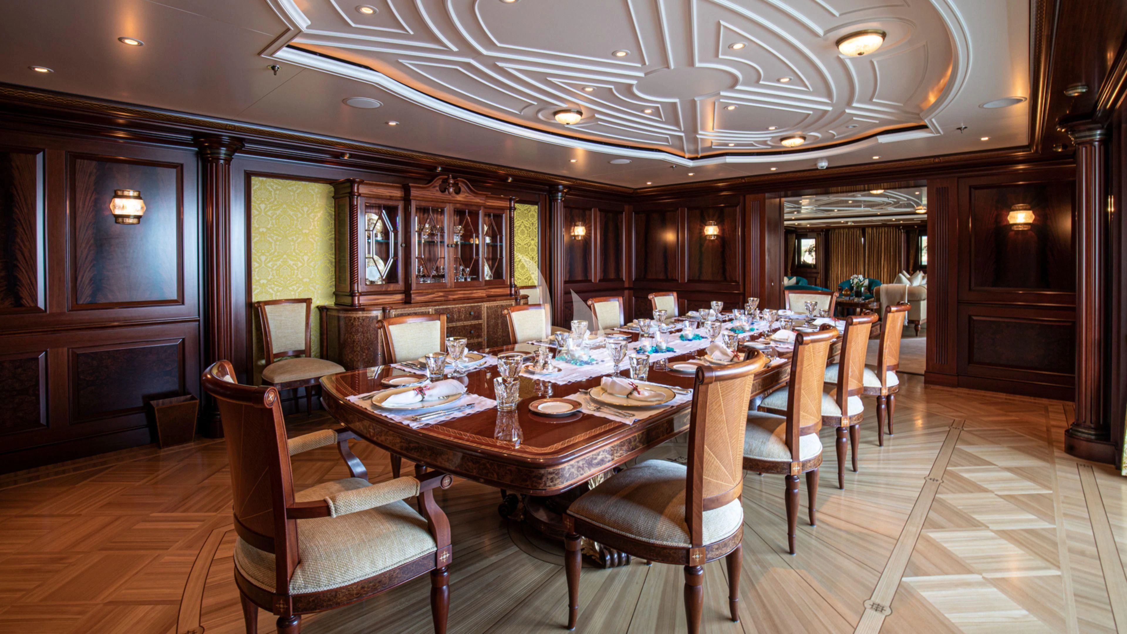 a large dining room with a table and chairs aboard FIREBIRD Yacht for Charter