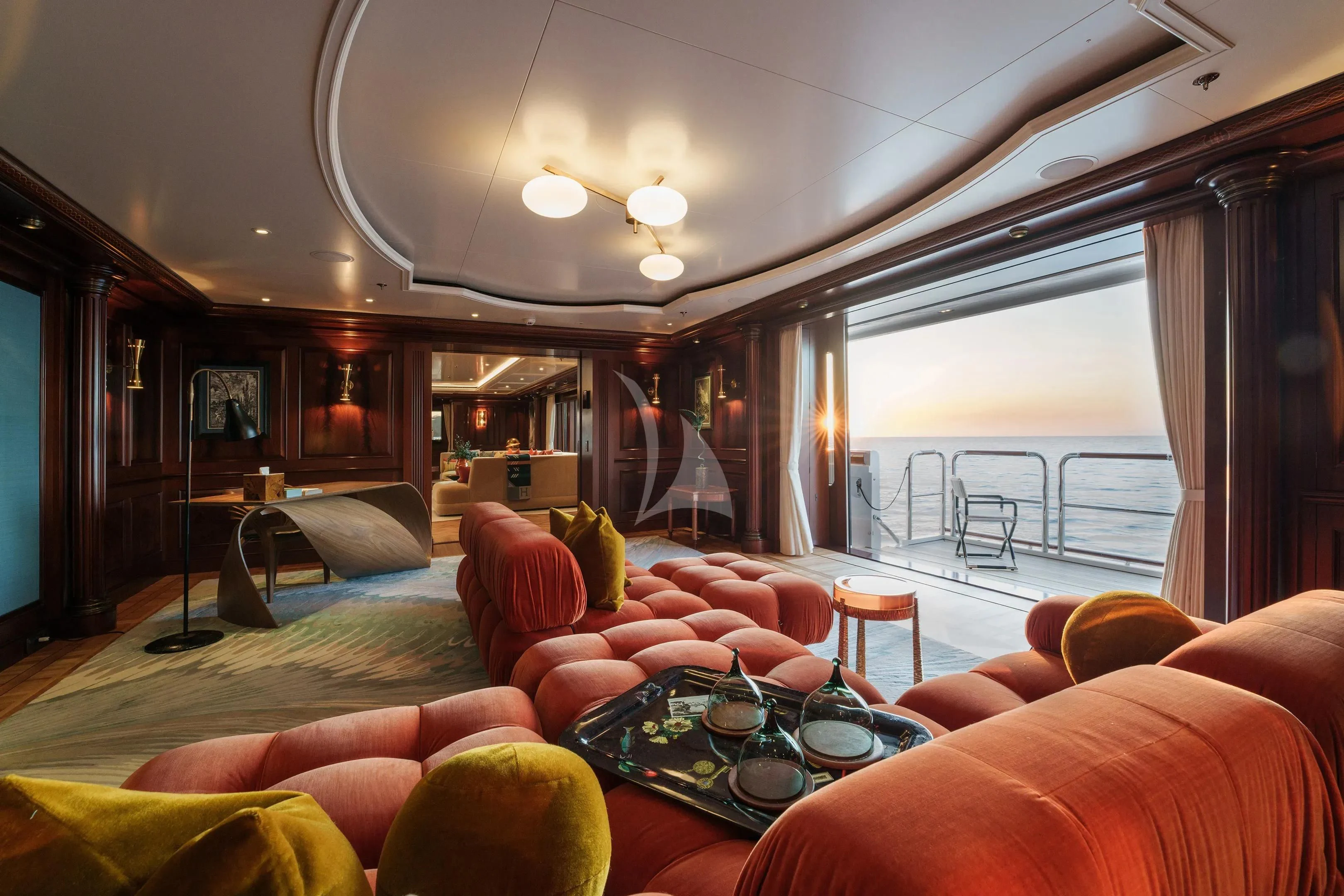 a living room with a large balcony aboard FIREBIRD Yacht for Charter