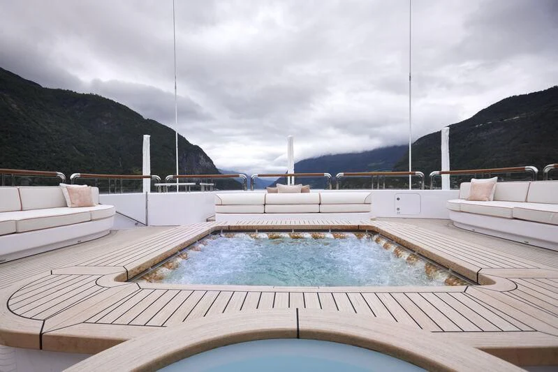 a pool with a water slide aboard FIREBIRD Yacht for Charter