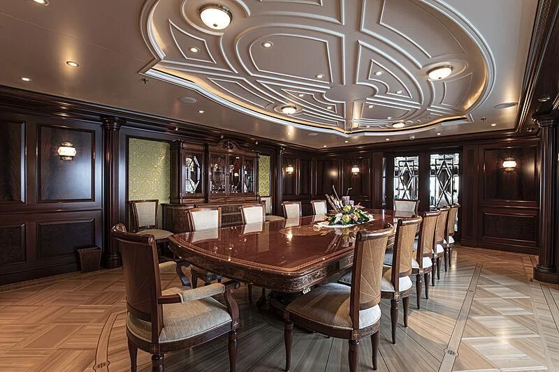 a large dining room with a large table and chairs aboard FIREBIRD Yacht for Charter