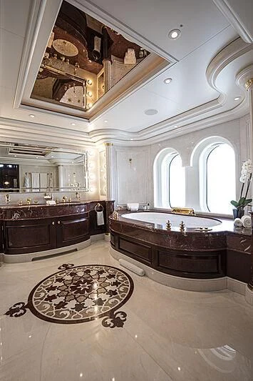 a large bathroom with a large tub aboard FIREBIRD Yacht for Charter